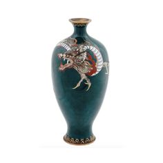 a blue vase with a dragon painted on it