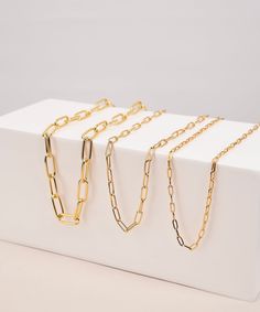 "Gold Link Chain Necklace, Custom Length Thick Chunky Chain, Long Rectangle Link Chain, Layering, Gold Choker, Paper Clip Necklace, Gold Layering Chain Necklace, Gold Link Choker Gift For Her, Thick chain Necklace, Layering Necklace Item Detail * Finish : 18K Gold Plated, Silver Plated * Link Dimensions(Outer diameter) : S : 3mm x 8mm M : 4mm x 12mm L : 8mm x 20mm HOW TO ORDER 1. Select options from the drop down menu 2. Add to cart and proceed to checkout Shipping The \"ship by\" date on your i Gold Link Chain Necklace, Paper Clip Necklace, Rectangle Necklace, Thick Chain Necklace, Chain Necklace Gold, Layered Chain Necklace, Gold Link Chain, Necklace Layering, Gold Link