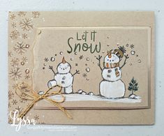 a handmade christmas card with two snowmen and the words let it snow written in green ink