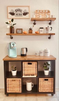 a coffee bar with wicker baskets on the top and shelves above it, along with two mugs