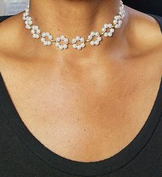 Whether you're attending a special occasion or simply want to feel fabulous, our Floral Pearl Choker is the perfect accessory to make a statement and leave a lasting impression. Embrace your inner charm and let this enchanting piece adorn your neck with sheer elegance. Elegant Pearl Jewelry For Parties, Chic Pearl Necklaces For Party, Crystal Necklaces For Party, Round Crystal Necklaces For Party, Adjustable Jewelry For Summer Party, Chic Party Necklace With Pearl Chain, Chic Pearl Chain For Party, Chic Pearl Chain Jewelry For Party, Chic Pearl Chain Necklace For Party