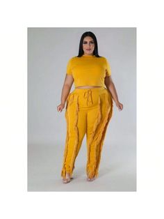 Elevate your wardrobe with our Crop Top Two-Piece Set, a chic ensemble that seamlessly combines modern style with comfort. Crafted from a luxurious blend of 95% polyester and 5% spandex, this set offers a soft, stretchy feel that moves with you throughout the day.

Key Features:
- Fabric: Made from 95% polyester and 5% spandex for a comfortable and flexible fit.
- Fit: Features a crop top with a round neck and short sleeves, paired with high-waisted pants.
- Color Options: Available in Dijon.
- Fitted Solid Two-piece Loungewear Set, Chic Cotton Two-piece Set, Fitted Casual Matching Sets, Chic Stretch Matching Pant Set, Chic Stretch Two-piece Pant Set, Fitted Loungewear Two-piece Set, Fitted Casual Loungewear Set, Casual Fitted Loungewear Set, Casual Fitted Two-piece Set