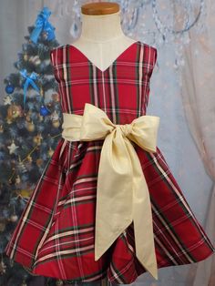 "Taffeta Party Dress in Red Green Black and Gold Plaid for Christmas. Adorable for viewing the Nutcracker Ballet or as Pageant Wear! Plaid Winter Dress is perfect for Christmas Dinner or any Holiday event. The Length used on this Sample is a Short Vintage Length Hand Made in the USA by Me! Custom Made to Measurements Provided Size 5T is pictured and Ready to Ship MATCHING \"BOYS VEST\" available Listing: https://www.etsy.com/listing/622934029/ ---------------------------------------------------- Festive Sleeveless Christmas Dress, Sleeveless Festive Christmas Dress, Red Sleeveless Holiday Dress, Sleeveless Holiday Dress For Festive Occasions, Red Sleeveless Christmas Holiday Dress, Festive Sleeveless Winter Dress, Fitted Sleeveless Christmas Holiday Dress, Sleeveless Holiday Dress For Winter, Sleeveless Winter Holiday Dress