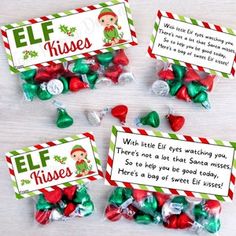 elf kisses candy bar wrappers with christmas candies in them on a white table