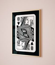 a black and white ace playing card mounted on a wall