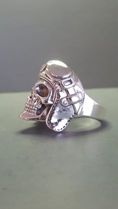 Sterling Silver Aviator Skull Ring Unique Silver Skull Ring Collectible, Collectible Sterling Silver Skull Ring With Polished Finish, Adjustable Silver Skull Ring Collectible, Handmade Adjustable Silver Skull Ring, Adjustable Handmade Silver Skull Ring, Adjustable Silver Jewelry For Biker Events, Silver Skull Biker Jewelry, Vintage Silver Skull Ring For Biker Events, Biker Silver Skull Jewelry