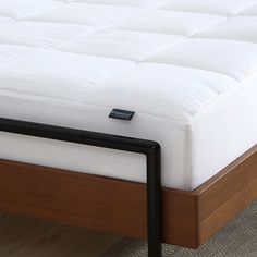 a close up of a mattress on a bed frame