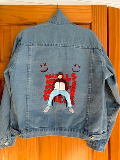 A hand painted denim Jacket inspired by the cover of Louis Tomlinson's debut album Walls. The sizing on the jacket is custom, jacket in the picture is a Size L. Louis Tomlinson Denim Jacket, Hand Painted Cotton Denim Jacket For Streetwear, Trendy Cotton Denim Jacket With Custom Artwork, Spring Casual Denim Jacket With Custom Artwork, Casual Spring Denim Jacket With Custom Artwork, Casual Blue Denim Jacket With Custom Artwork, Casual Hand Painted Cotton Denim Jacket, Custom Artwork Cotton Denim Jacket For Streetwear, Hand Painted Cotton Denim Jacket For Winter