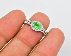 "Natural Tsavorite Ring, Gemstone Ring, 925 Sterling Silver, Women Ring, Engagement Ring, January Birthstone, Green Stone Ring, Gift For Her  ►Made of solid sterling silver with a rhodium finish (925) ● Code --- RG-1398 ● Main Stone --- Natural Tsavorite Green Garnet  ● Birthstone Month ---  January  ● Color --- Green   ● Gem Size ---  7x5  MM ● Carat Weight --- 0.65 ct. (approx.) ● Total Weight --- 2.80 Gram ● Gemstone Creation --- 100% Natural Some of the amazing additional features of this product: ● Fine, professional cut natural gemstones - not synthetic, lab created, nor simulated ● Elegant, makes beautiful engagement gift; anniversary gift; bridesmaid gift; gift for girlfriend; gifts for     mom; gift for fiancée ● Suitable for all special occasions ♥ Benefits of wearing Tsavorite g Tsavorite Ring, Green Stone Ring, Garnet Birthstone, Green Stone Rings, Green Garnet, Green Gems, January Birthstone, Women Ring, Ring Gemstone