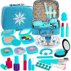 an assortment of makeup and beauty products in a blue case with snowflakes on it