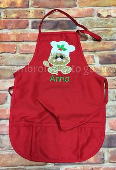 a red apron with an animal on it