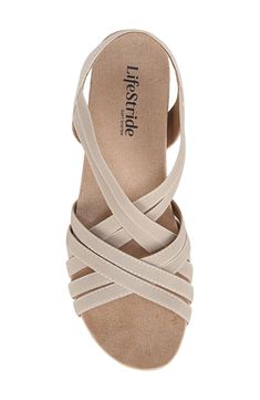 Treat your feet to all-day comfort in this chic strappy sandal balanced on a cork-wrapped wedge with a soft lining and gentle padding. 1" platform Elasticized slingback strap Soft System® comfort package provides all-day support, flex and cushioning Synthetic upper, lining and sole Imported Comfortable Beige Wedge Sandals With Arch Support, Spring Strappy Wedge Sandals With Arch Support, Beige Synthetic Slingback Wedge Sandals, Strappy Synthetic Wedge Sandals With Arch Support, Cream Synthetic Wedge Sandals With Cushioned Footbed, Cream Wedge Sandals With Cushioned Footbed, Synthetic Strappy Wedge Sandals With Arch Support, Beige Synthetic Wedge Sandals With Heel Strap, Beige Wedge Heel Slingback Sandals