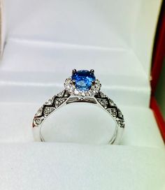 Gorgeous 14k White Gold Sapphire and halo Diamond Ring: Sapphire: 0.74CT Side Diamonds: 0.40CT Color: E Clarity: VS2 Total ring weight: 3.5GR 14K White Gold Ring sizing available free of charge For more information regarding this item feel free to reach me so I can accommodate your needs. Thank you Gia Certified 14k White Gold Cluster Ring, Gia Certified Diamond Cluster Halo Ring, Sapphire Ring With Halo Setting For Proposal, 14k White Gold Cluster Ring With Halo Design, Gia Certified Round Cut Halo Ring For Promise, Fine Jewelry Halo Ring With Center Stone For Proposal, Platinum Cluster Ring With Halo, Platinum Cluster Ring With Halo Detail, Gia Certified White Gold Sterling Silver Halo Ring