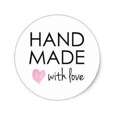 a round sticker with the words hand made with love written in black and pink ink