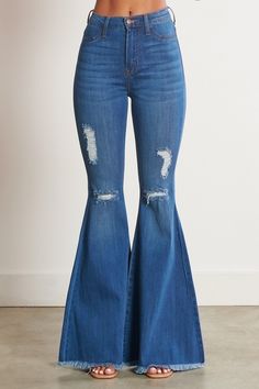 Don't just rock the concert scene - own it! These Lainey Concert Bell Bottom Jeans reign the fashion kingdom with iconic old school bell bottoms and just-right blue denim. Look cool and feel comfy in these edgy jeans made for concert outfits that stand out from the crowd. Ready to rock? Go for it! A pair of exaggerated, high-rise flare jeans featuring a front whiskered wash, open distressed knee detail, classic 5-pocket construction, frayed raw hem, and a zip-fly closure. (3) Rise: 11" Inseam: 3 Edgy Jeans, Rush Dresses, Bodycon Fashion, Complete Outfits, Bell Bottom, High Rise Jeans, Premium Denim, Outfits Casuales, Denim Fabric