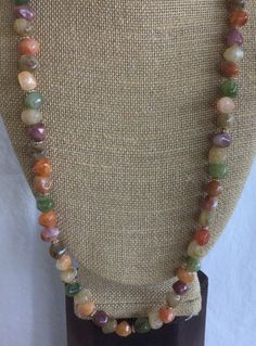 "Featuring this lovely multi-colored faux stone nugget beaded necklace.  It has gold tone spacer beads and measures 29-3/4\".  The necklace is in very good vintage condition and has a spring ring clasp." Multicolor Agate Beaded Necklace With Large Beads, Multicolor Agate Large Beaded Necklaces, Multicolor Agate Necklaces With Large Beads, Multicolor Large Beads Agate Necklace, Multicolor Agate Beaded Necklaces With Oval Beads, Multicolor Long Necklace With Round Natural Stones, Faux Stone, Plastic Beads, Spring Rings