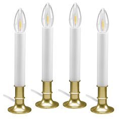 three white candles are lined up next to each other, with one candle in the middle