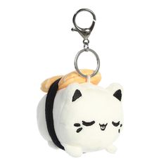 a white and black cat keychain hanging from a metal hook on a white background