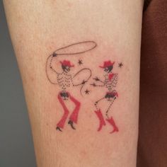 a tattoo with two people dancing on it