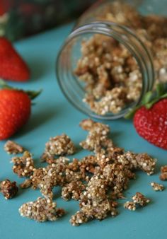 some strawberries and granola on a blue table