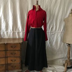 "Amazing & Rare Wool Jacket & Skirt Victorian Era This is quite an amazing and rare antique from the late 1800s early 1900s. We believe it was most likely a peasant outfit or women's work/servant outfit or house dress. Possibly a factory worker. It is 100% wool (in red & black), a two piece. The skirt is lined in a very rustic and natural cotton weave fabric (all hand sewn). The collar is very unusual as well as the French cuff sleeves.(shown on the mannequin unbuttoned). The front o Servant Outfit, Peasant Outfit, Suffrage Movement, Factory Worker, Period Clothing, Work Clothing, Period Outfit, French Cuff, Weave Fabric