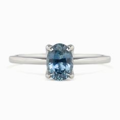 * One of a kind ring * In stock, ready to ship in size 7 * 1.06ct Oval Cut Montana Sapphire Blue 6.96x5.07x3.65mm Heated * Center stone clarity: si2-obvious inclusions that can be easily seen under 10x magnification. A slight effect on appearance and brilliance. * Center stone note: feather under the girdle * Bandwidth: approx. 1.4mm * High profile four prongs flower setting * Ethically sourced solid 14k white gold and gemstones * Packaged in a recyclable kraft ivory ring box Sapphire Ring Simple, Montana Sapphire Engagement, Montana Sapphire Engagement Ring, Ivory Ring, Flower Setting, Montana Sapphire Ring, Sapphire Solitaire Ring, Ring Sapphire, Sapphire Band