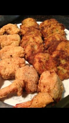 some fried food is on a plate and ready to be eaten at the restaurant or take out