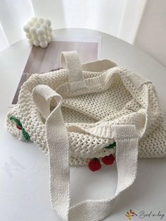 a crocheted bag sitting on top of a table