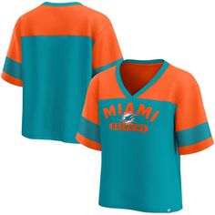 Look and feel like you're part of the team with this Miami Dolphins Homeschool Jersey Poly V-Neck Fashion Top from Fanatics. This stylish top boasts a unique design, featuring a contrast color mesh panel sewn onto the sleeves for a sporty look. The screen-printed team name and logo across the front make it clear you're a dedicated Miami Dolphins fan. Orange Team Spirit Tops For Sports Events, Orange Tops For Sports Events With Team Spirit, Orange Team Spirit Sports Top, V-neck Tops For College Sports Season, Collegiate Sports V-neck Top, Collegiate Orange Tops For Game Day, Collegiate V-neck Sports Top, Orange Tops For Fan Gear With Team Spirit, Sporty Orange Tops For Sports Events