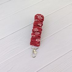 Red Holiday Cany Peppermint Keychain Wristlet. Enjoy this winter scrunchie keychain for your purse, backpack, tote, diaper bag, scripture case, etc. Where fashion meets function. Perfect for gifting! Available as a set with a matching scrunchie hair tie.  When purchased as a set, enjoy a generous discount. Each scrunchie Wristlet Keychain is handmade by us just for you in our home studio. Made with care to ensure you receive a quality product that will last forever! Machine Sewn. Our photos are Scrunchie Wristlet, Scrunchie Keychain, Scripture Case, Red Keychain, Christmas Peppermint, Backpack Tote, Keychain Wristlet, Scrunchie Hair, Purse Backpack