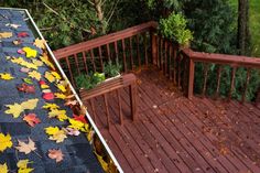 the deck is covered with autumn leaves