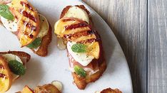 grilled peaches and mozzarella on toasted bread with mint garnish