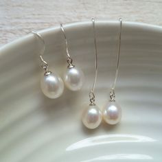 Pearl drop dangle earrings serve as a dainty and elegant accent without overpowering the rest of your outfit making them ideal as part of a bridal outfit or for the bridesmaids at your wedding.  The moment you choose to wear dainty pearl drop earrings, either basic or statement-like, it's best to tie up your hair in a bun or a more sophisticated updo to let the earrings stand out and enhance your facial features.  FEATURES: * real cultured freshwater pearls * ivory white with beautiful lustre * .925 sterling silver ear hooks  * nickel-free * entirely handmade in the UK * free first class shipping within UK  You may also like these pearl stud earrings here: https://www.etsy.com/listing/769109465/ Elegant White Drop Threader Earrings, Elegant Dangle Threader Earrings For Weddings, Elegant Teardrop Threader Earrings For Wedding, Classic White Threader Earrings As Gift, Wedding Dangle Threader Earrings, Delicate Dangle Threader Earrings For Wedding, Wedding Pearl Drop Dangle Threader Earrings, Delicate Wedding Dangle Threader Earrings, White Threader Earrings For Wedding