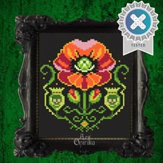 the cross stitch pattern has an ornate frame with flowers on it