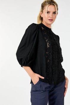 Indulge in the feminine elegance of our Women's 3/4 Lace Crochet Button Down Blouse. Crafted with delicate lace crochet, this top exudes sophistication and grace. The button-down design adds a touch of classic charm. Elevate your wardrobe with this exclusive and timeless piece. This top boasts delicate lace detailing that exudes femininity and refinement while its 3/4 sleeves strike a balance between coverage and freedom of movement. The collarless design lends a modern touch.Additionally the long popcorn sleeves add texture and visual interest elevating the tops overall appeal. - Solid - Round neckline I Collarless - Lace detailing - 3/4 Sleeve I Popcorn Lace Blouse With Button Closure For Work, Fall Lace Top With Button Closure, Spring Lace Trim Button-up Top, Spring Button-up Lace Top With Lace Trim, Elegant Spring Blouse With Crochet Trim, Elegant Crochet Trim Blouse For Spring, Elegant Lace Top With Crochet Trim, Elegant Blouse With Crochet Trim For Spring, Elegant Fall Lace Crochet Top