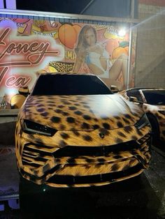 two cars that are covered in leopard print