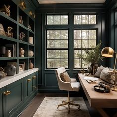 a home office with green walls and shelves