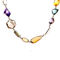 Multi-Gemstone Necklace in 14k Yellow Gold This exquisite modern necklace is crafted from 14 karat yellow gold, creating a luxurious and elegant piece that is sure to spark a conversation. The long piece features a series of multi-gemstone bezel set stones, with a total of 91.52 carats of citrine, 89.96 carats of aquamarine, 80.66 carats of quartz, 79.55 carats of amethyst, 41.31 carats of tourmaline, and 10.20 carats of topaz.  The perfect combination of modern design and luxurious gemstones, t Luxury Multi-stone Necklaces For Formal Occasions, Elegant Faceted Gemstones For Formal Occasions, Luxury Formal Multi-stone Necklace, Luxury Yellow Gold Briolette Gemstones, Exquisite Multi-stone Necklace For Formal Occasions, Briolette Natural Stones Necklace For Formal Occasions, Briolette Natural Stones Necklace For Formal, Formal Faceted White Gold Necklaces, Formal Faceted Briolette Necklaces