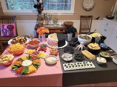 a table filled with lots of food and snacks