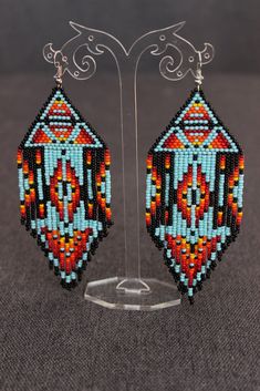 "These earrings are made of Czech beads. The lenth of the earrings is approx. 5.5\", width 2.4\" The thread used is synthetic and very strong. Please ask if you have any questions. Shipping to the USA may take to 30 days (but usually it is about 10-15 days)" Traditional Beaded Earrings With Round Beads, Traditional Turquoise Beaded Earrings, Festival Jewelry With Round Beads And Ear Wire, Southwestern Dangling Beads Earrings Gift, Southwestern Dangle Beaded Earrings As Gift, Southwestern Style Dangling Beads Earrings As A Gift, Southwestern Dangle Beaded Earrings For Gifts, Southwestern Style Round Bead Earrings For Festivals, Southwestern Style Dangling Beads Earrings For Gift