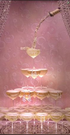 a table topped with lots of champagne glasses