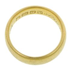 Measuring 5mm in overall width. Hand engraved inside shank. Fashioned in 22k yellow gold. Full hallmarks for Birmingham England; 1914. Size 5. Formal Yellow Gold Engraved Ring With Decorative Band, Heirloom Yellow Gold Hallmarked Bands, Engraved Yellow Gold Bands For Formal Occasions, Heirloom Hallmarked Yellow Gold Bands, Stamped 14k Round Band Engraved Ring For Marriage, 14k Stamped Round Band Engraved Ring For Marriage, 14k Stamped Engraved Ring For Marriage, Classic Yellow Gold Engraved Ring With Maker's Mark, Classic 14k Stamped Rings For Marriage