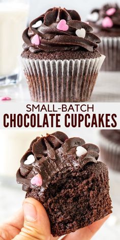 chocolate cupcakes with pink and white hearts on top are being held up in front of the camera