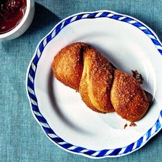 two croissants on a blue and white plate