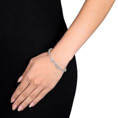 Show her you mean forever with our stunning bracelet featuring a diamond-filled infinity symbol linked to a smooth and polished heart.Features: Quick ShipDiamond Clarity: I2-I3Shape: Infinity, HeartStone Cut: RoundDiamond Color: G-HMetal Color: WhiteChain Length: 7 1/2 InchRounded Carat Weight: 1/10 Ct. T.w.Care: Wipe CleanAuthenticity: Natural DiamondBirthstone: April BirthstoneBracelet Type: Chain Bracelets, Tennis BraceletsMetal: Sterling SilverIs Beaded: NoCountry of Origin: Imported Elegant Valentine's Day Heart Bracelet, Elegant White Gold Charm Bracelet For Mother's Day, Elegant Charm Bracelet For Valentine's Day, Elegant Valentine's Day Charm Bracelet, White Gold Round Heart Bracelet, Infinity Bracelet For Valentine's Day, Elegant Hypoallergenic Heart Bracelet For Anniversary, Hypoallergenic Chain Bracelet For Anniversary, Elegant Metal Charm Bracelet For Mother's Day