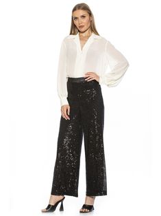 SALE Enhance your fashion statement with the luxurious Illy Sequin Pants. These high waisted pants feature a glamorous wide leg design and full sequin embellishments for a tasteful and exclusive look. Stand out in style and sophistication with Illy. PRODUCT FEATURES Full length  Sequin Material  High Waisted Pant Wide Leg Pant 92% Polyester, 8% Spandex Lining: 100% Polyester Hand Wash Imported Style P144 Sequin Trousers, Sequin Cami Top, Sequin Pant, Palazzo Trousers, Sequin Pants, Size 10 Models, Sequin Design, Blazer And Skirt, Exclusive Clothing