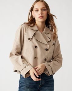 Enhance your wardrobe with the SIRUS jacket. This cropped trench boasts a double-breasted design and features two functional side pockets. The two wind flaps provide added functionality while the shoulder epaulettes and sleeve cuff belts add a touch of style. Complete with a pleated back flap, this jacket is both practical and chic. Cropped trench coat Double-breasted button closure 2 functional side pockets Length: 21.5" 100% polyester Care instructions: hand wash cold separately, do not bleach, lay flat to dry, low iron if necessary, or dry clean Nikole is 5ft 10in and is wearing a size small Imported Beach Wedding Black, Cropped Trench Coat, Shoulder Epaulettes, Trench Coat Outfit, Khaki Jacket, Wedding Dress With Veil, Long Sleeve Dress Formal, Apparel Merchandising, Trench Jacket