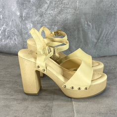 Sarto By Franco Sarto Women's Lemon Leather Wally Ankle Strap Platform Sandals Sz 8 Bold Studs Faux-Wood Platform 4 1/4" Heel; 1 1/2" Platform Leather Upper/Synthetic Lining And Sole Made In Brazil This Is A New Without Tags/Box Item. Please Refer To Images. Cream Closed Toe Sandals With Wooden Heel, Cream Heels With Wooden Heel And Ankle Strap, Cream Heels With Wooden Heel For Summer, Cream Ankle Strap Heels With Stacked Heel, Cream Closed Toe Clogs For Summer, Summer Clogs With Heel And Ankle Straps, Cream Sandals With Stacked Heel And Ankle Strap, Summer Ankle-high Leather Heels, Summer Cream Heels With Wooden Heel