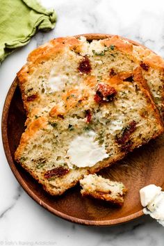 two slices of bread on a wooden plate