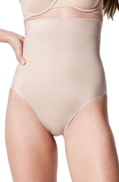 This lightweight thong compresses and smoothes with 24/7 comfort and no panty lines. Cotton-lined gusset 51% elastane, 49% nylon Dry clean or machine wash, dry flat Imported Supportive Smoothing Beige Shapewear, Supportive Beige Smoothing Shapewear, Full Coverage Stretch Shapewear Bottoms, Stretch Full Coverage Shapewear Bottoms, Elegant Full Coverage Stretch Shapewear, High Stretch Smoothing Beige Bottoms, Fitted Shapewear Bottoms With Moderate Coverage, Elegant Full Coverage Supportive Shapewear, Supportive Brief Bottoms With Moderate Back Coverage